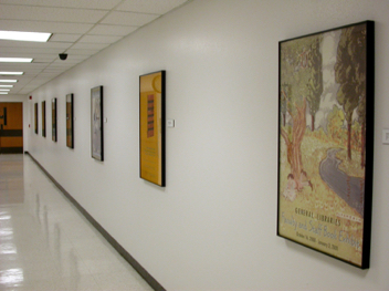 The PCL Level 1 gallery space features flat digital collage prints as well as  three-dimensional assemblages.