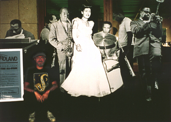 Life-sized all-star cut-out jazz septet jams onstage as “Jazz” exhibit designer/co-curator sits in, UT Austin, 2004.